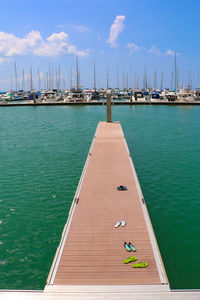 Pier on sea against sky