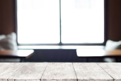 Close-up of empty seats on tiled floor