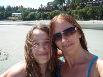 Portrait of two smiling young women on beach