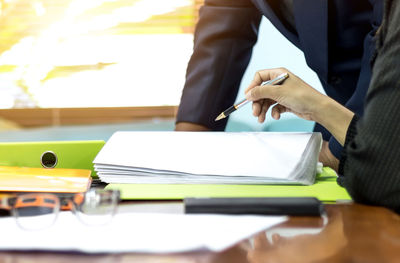 Close-up of hands working on table