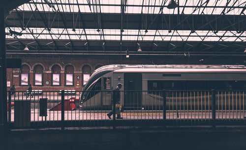 Woman walking at railroad station