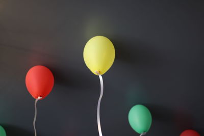 Low angle view of balloons in mid-air