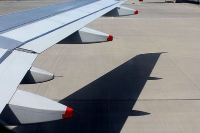 High angle view of airplane on airport runway