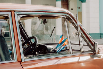 Cuban flags in vintage car