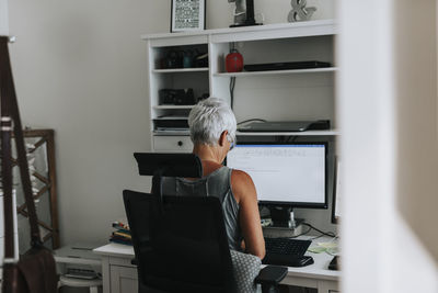 Woman using computer at home