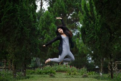 View of woman jumping in park