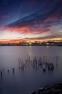 Scenic view of lake against sky during sunset