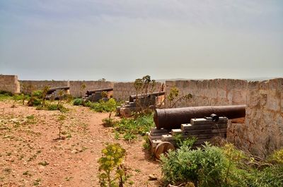 Old ruin on field against sky