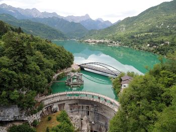 High angle view of river amidst trees and mountains