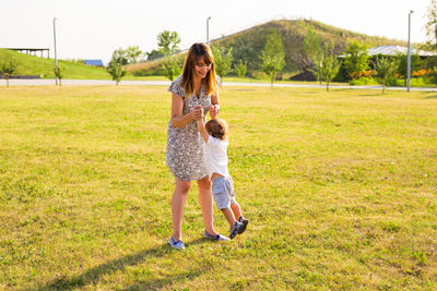 Full length of woman standing on field