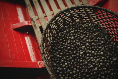 High angle view of red balls in basket