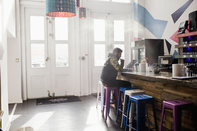 Young man at a cafe