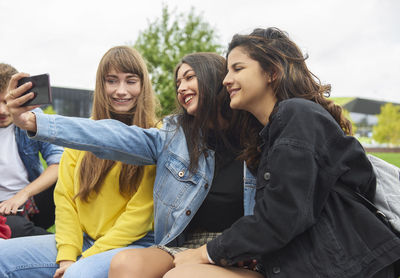 Women sitting on a couple looking at view