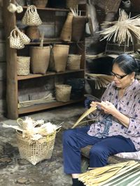 The old lady doing the basketwork