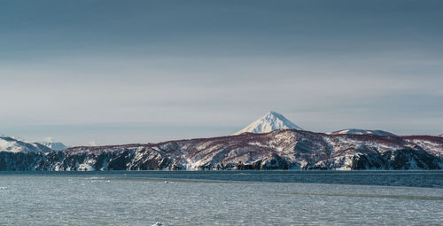 Scenic view of snowcapped mountain against sky