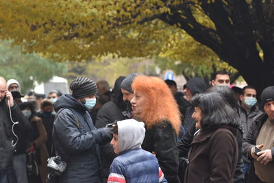 Group of people standing in city