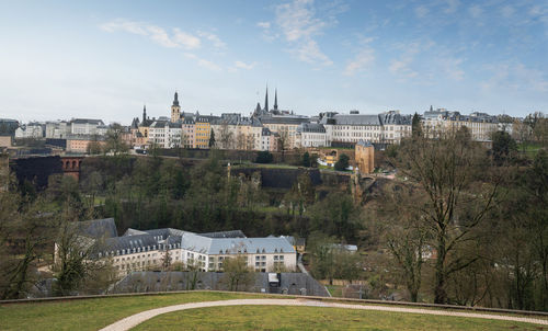 Buildings in city against sky