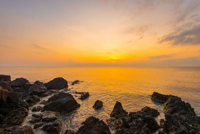 Scenic view of sea against sky during sunset