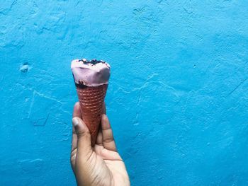 Midsection of person holding ice cream