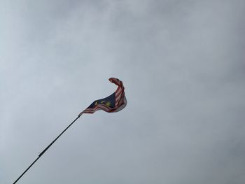 Low angle view of malaysian flag against sky