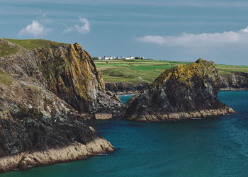 Scenic view of sea against sky at kynance cove in cornwall, england