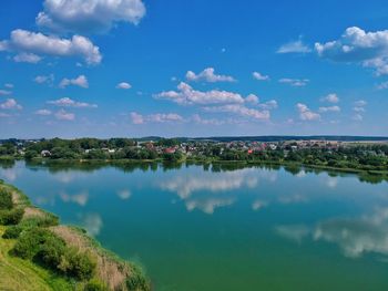 Scenic view of lake against blue sky