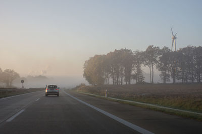 Car on road against clear sky