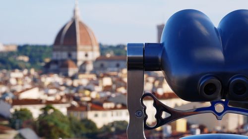 Close-up of binoculars in city