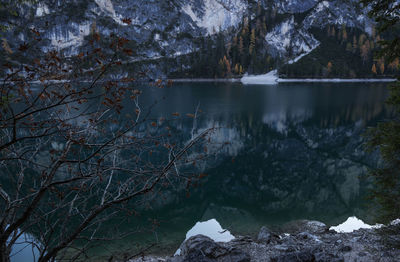 Scenic view of lake in forest at lago di braies, dolomites mountains 