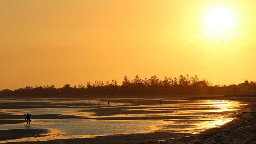 Scenic view of sea at sunset