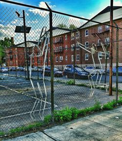 Chainlink fence seen through chainlink fence