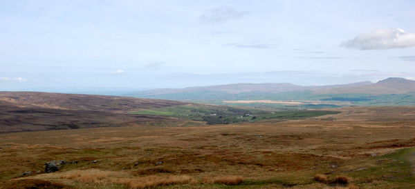 Scenic view of landscape and mountains against sky