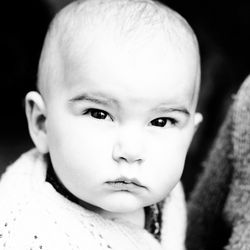 Portrait of baby on black background