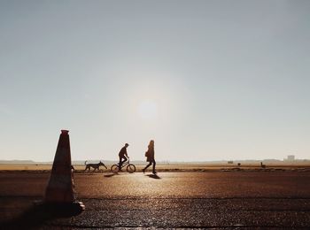 Silhouette of woman at sunset