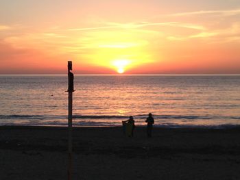 Silhouette of people on beach