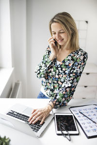 Young woman using mobile phone