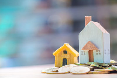 Close-up of toy on table against building