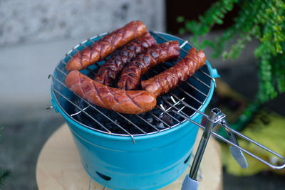 Close-up of sausages on barbecue grill