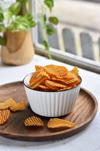 Close-up of potato chips on table