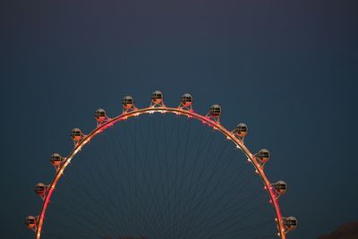 Low angle view of ferris wheel against sky