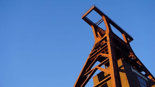 Low angle view of metal structure against clear sky