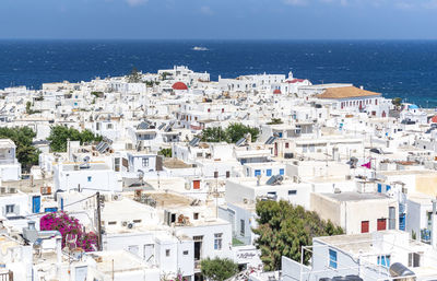 High angle view of townscape by sea