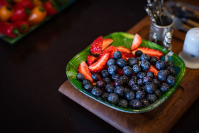 High angle view of strawberries in plate on table