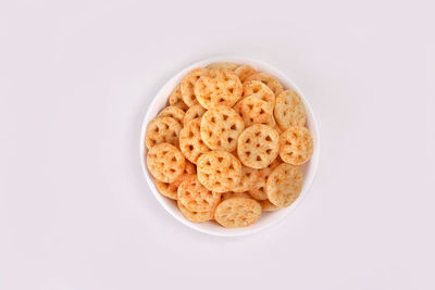 High angle view of breakfast on table against white background