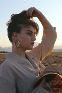 Portrait of young woman looking away