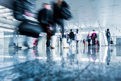 Group of people walking at airport