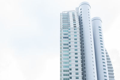 Low angle view of modern buildings against clear sky