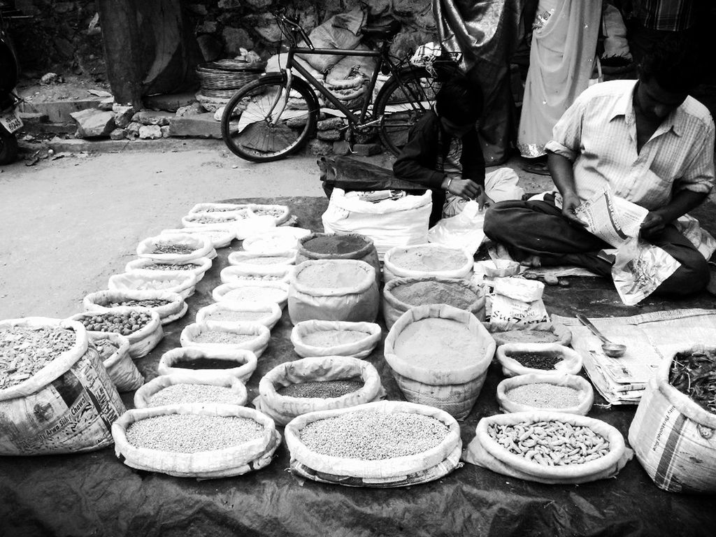 abundance, large group of objects, for sale, retail, market, stack, market stall, variation, choice, arrangement, men, in a row, food and drink, food, high angle view, street, small business, day, outdoors