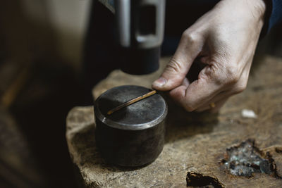 Cropped hand of person working on table