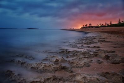 Scenic view of sea against sky at sunset